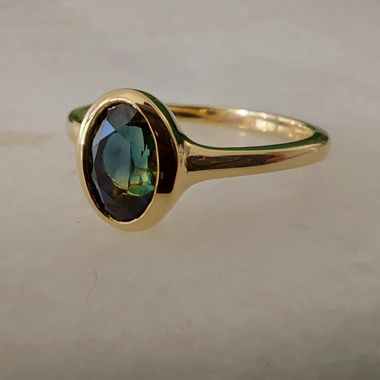 .90ct Teal Oval Australian Sapphire 9ct Yellow Gold ring