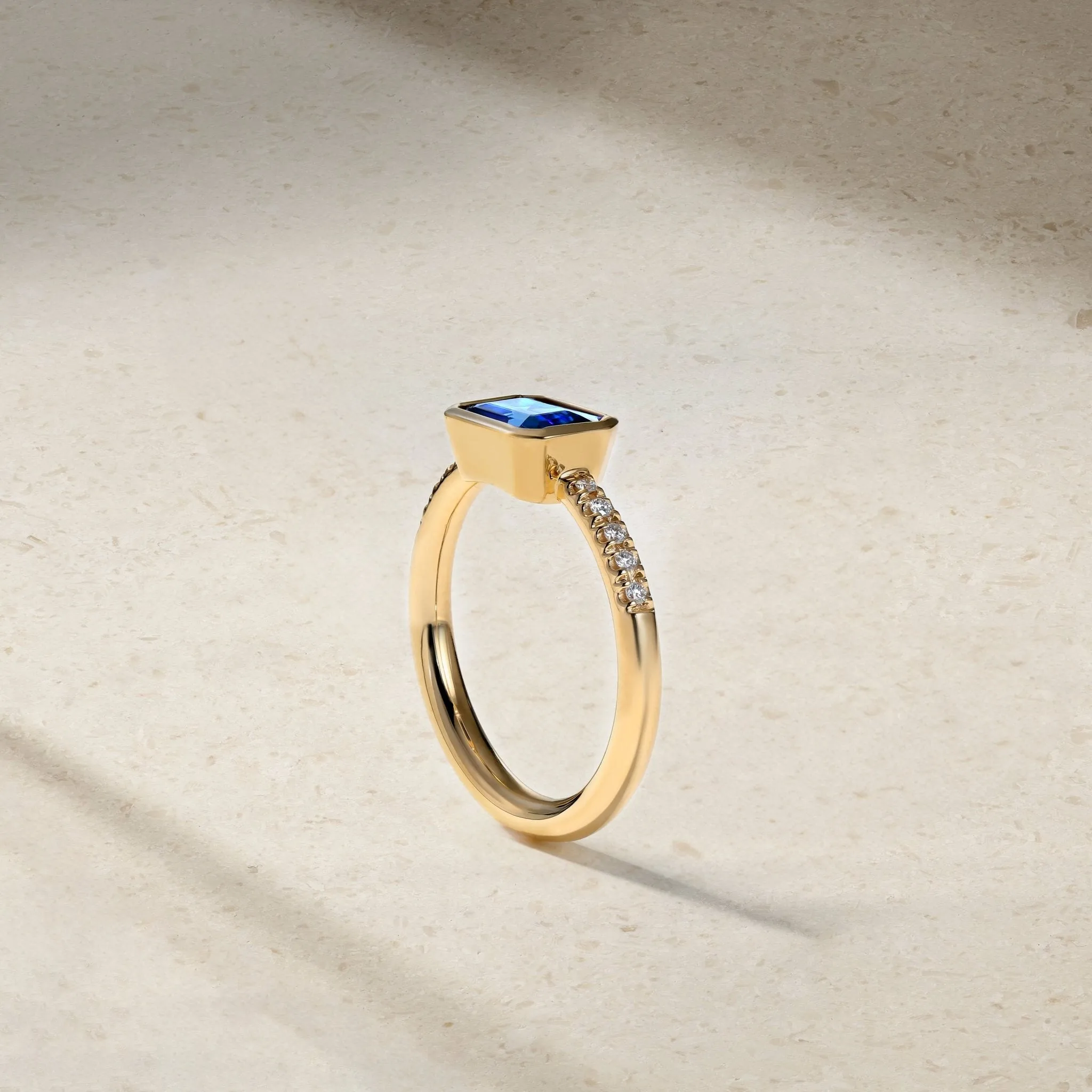 East-West Emerald Cut Sapphire and Diamond Bezel Ring