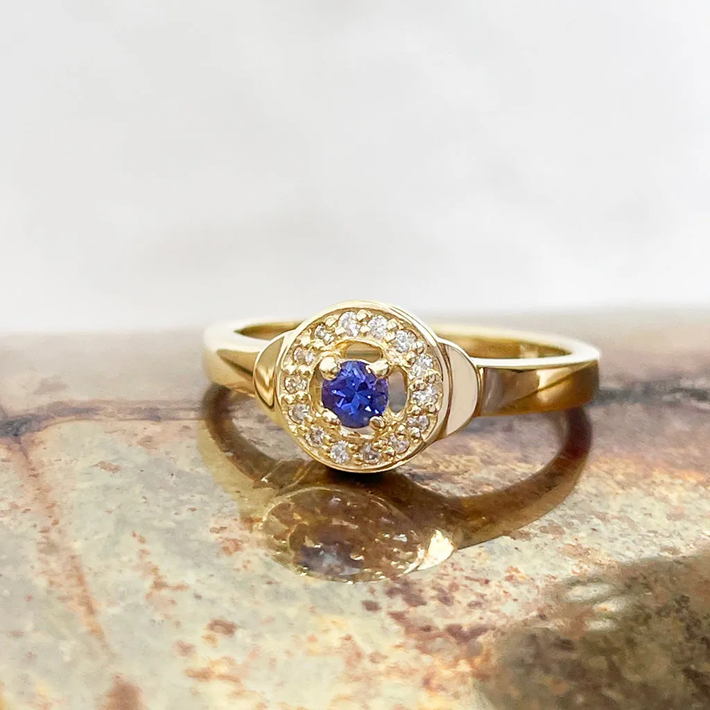 Regally Elevated Tanzanite Diamond Halo Yellow Gold Ring