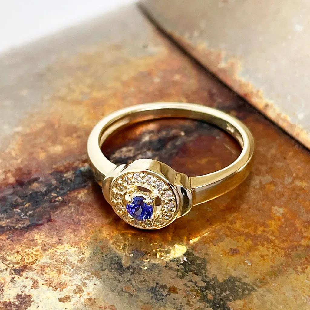 Regally Elevated Tanzanite Diamond Halo Yellow Gold Ring