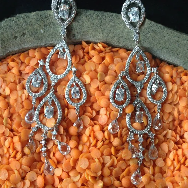 Rhodium Plated Chandelier Earrings with Dangling Oval and Pear Shaped CZs